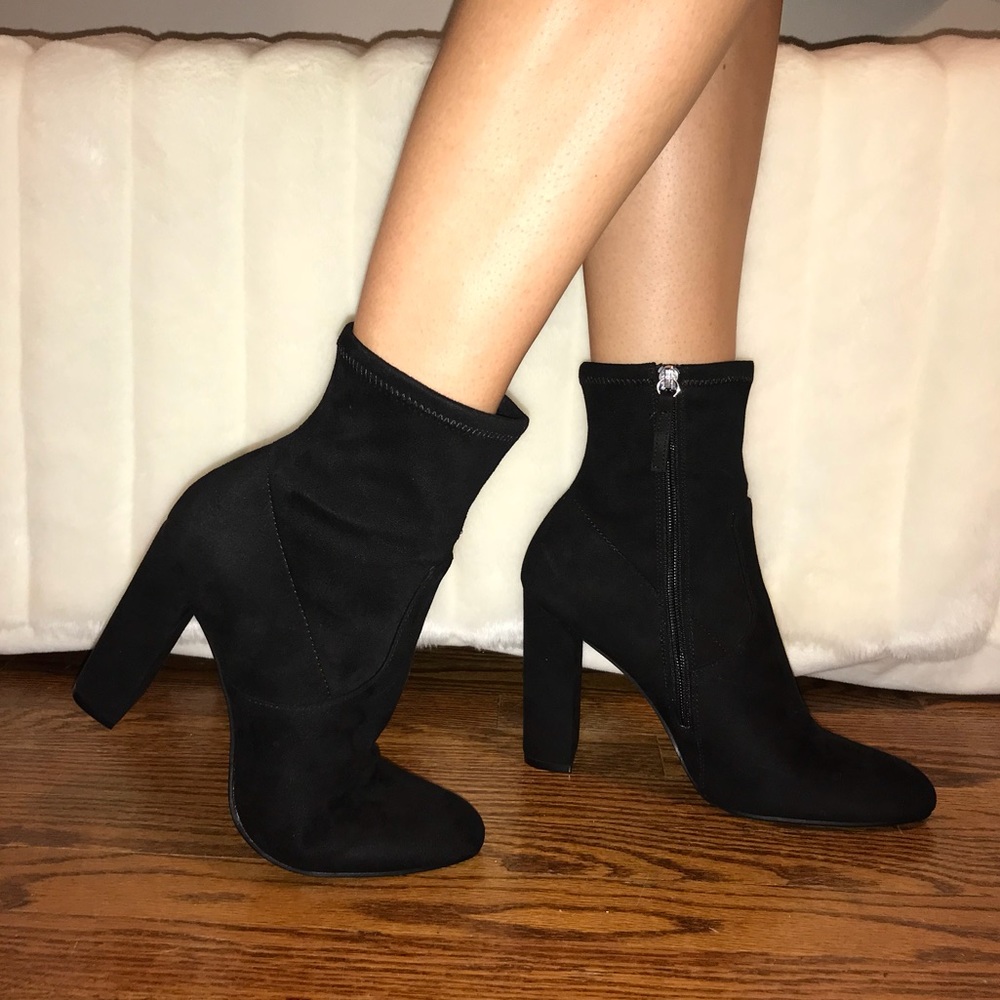 Black Steve Madden sock booties.